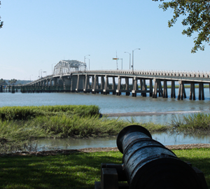 Dataw Island Listings. a bridge over water and a canon